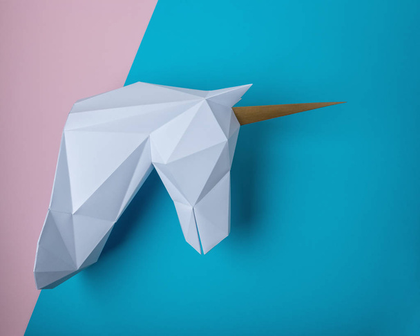 White 3d papercraft model of unicorn head on bright background. Minimal art concept. - Fotoğraf, Görsel