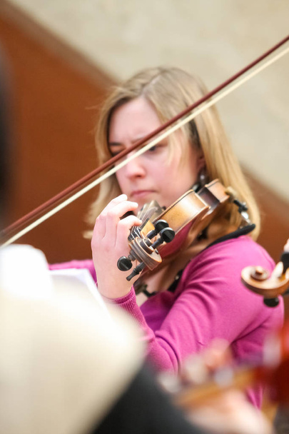 Diverse youth at music school orchestra  - Foto, Bild