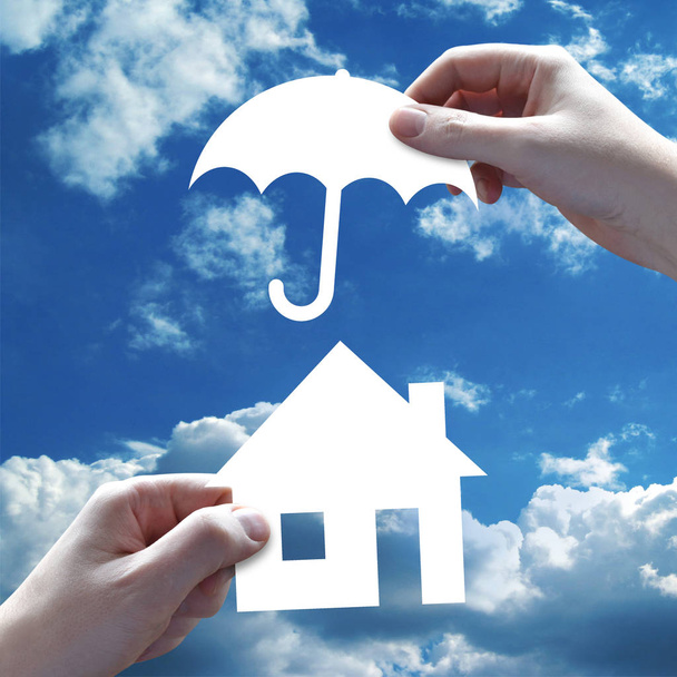 House insurance concept, hands, sky in background - Photo, Image