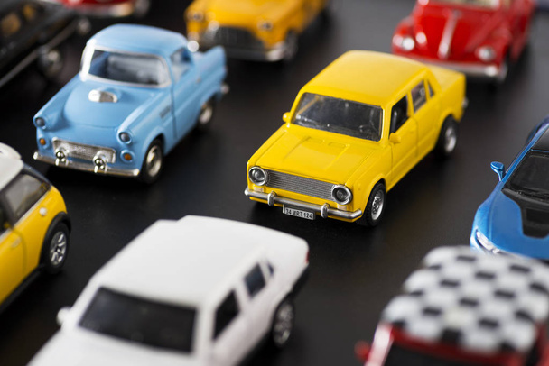 Various some brand toy cars on a black ground, looks like a traf - Φωτογραφία, εικόνα