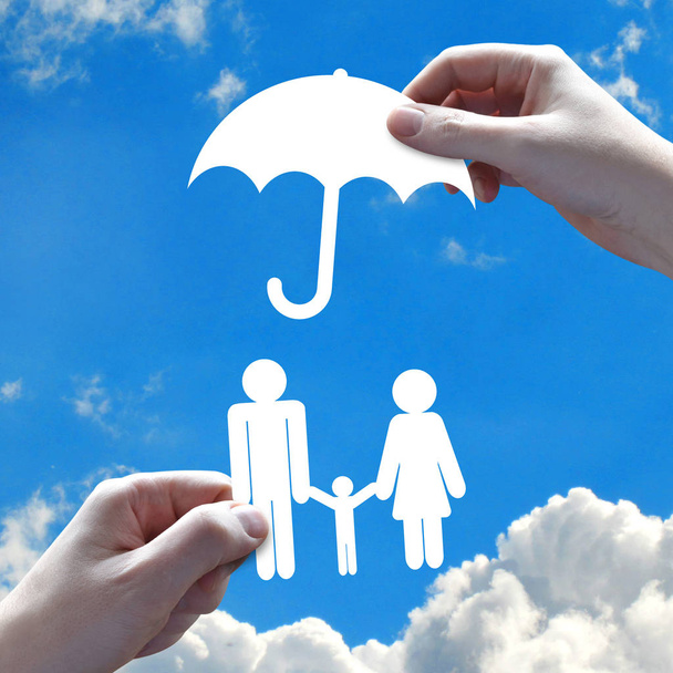 Family insurance concept, hands, sky in background - Photo, Image