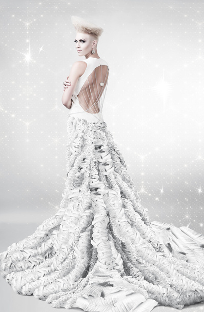 woman in long white dress with creative hairstyle - Photo, image
