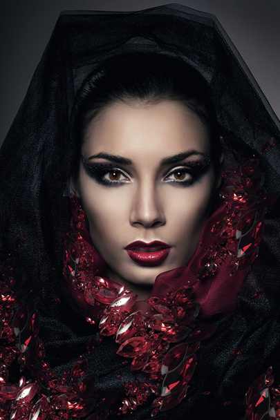 portrait of woman in hood with gemstones - Photo, Image