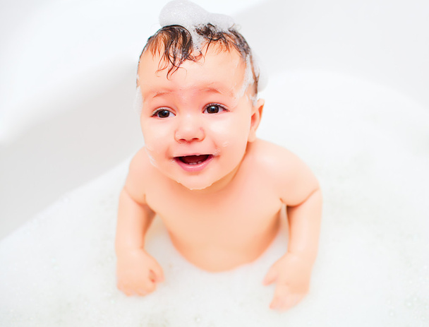 Cute little baby having bath in foam - Φωτογραφία, εικόνα