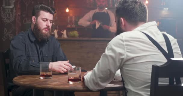 Pleasant nice looking bearded men dealing the playing cards - Footage, Video