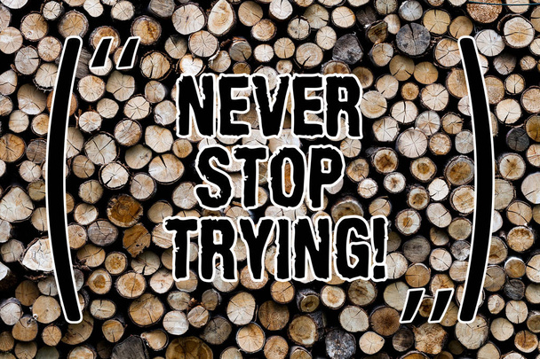 Text sign showing Never Stop Trying. Conceptual photo go on do not give up Self confidence Wooden background vintage wood wild message ideas intentions thoughts. - Photo, Image