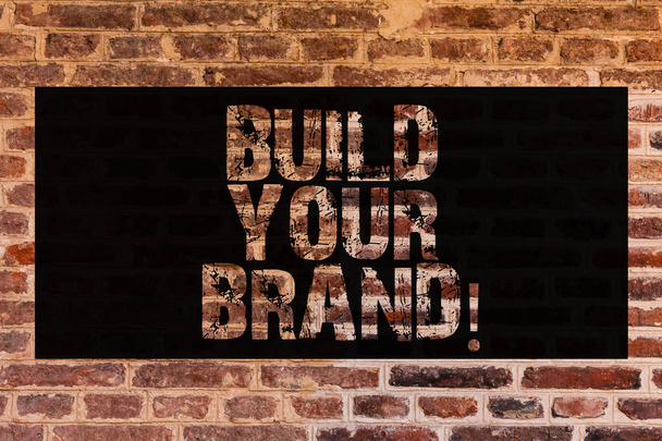 Text sign showing Build Your Brand. Conceptual photo create your own logo slogan Model Advertising E Marketing Brick Wall art like Graffiti motivational call written on the wall. - Photo, Image