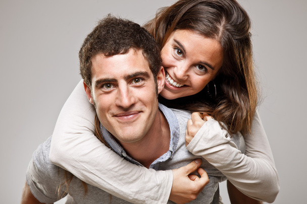 Portrait of a beautiful young happy smiling couple - 写真・画像