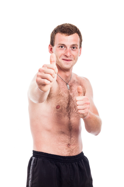 shirtless man duimschroef opwaarts - Foto, afbeelding