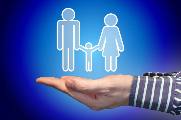 Hand, blue background, family insurance concept - Foto, immagini