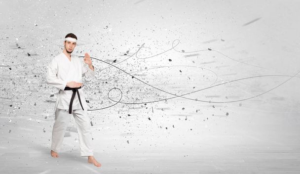 Karate man doing karate tricks with chaotic concept - 写真・画像