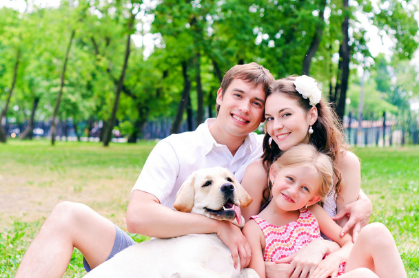 Happy young family with Labrador - Photo, Image