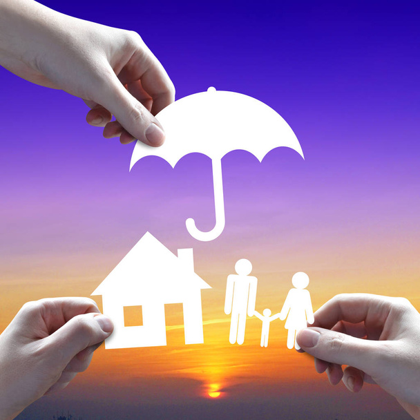 House and family protection concept, umbrella, sunset sky in bac - Photo, Image