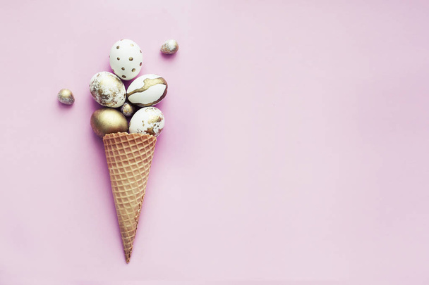 Holiday decoration with Easter eggs in waffle cone on pink background - Foto, Imagem
