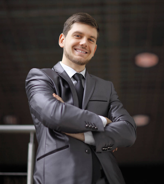 portrait of confident businessman on background of office. - Photo, image