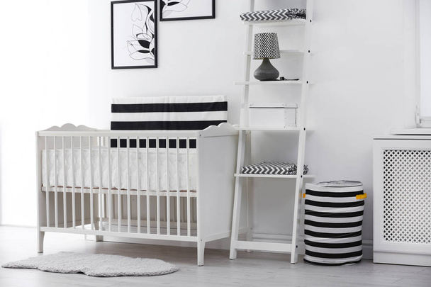 Baby bedroom interior with crib and beautiful decor elements - Photo, Image