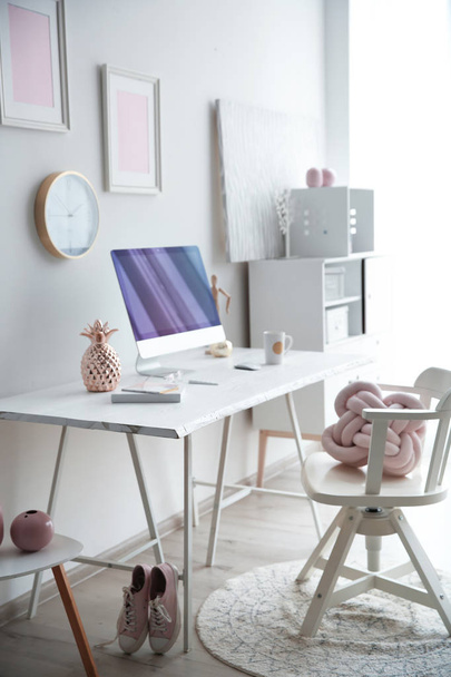 Contemporary workplace with computer on table near white wall. Interior design - Foto, imagen
