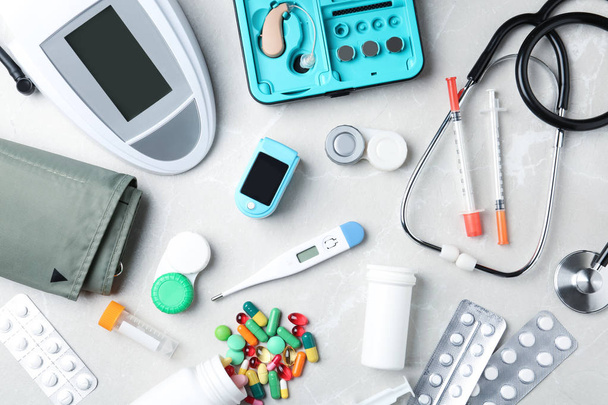 Flat lay composition with medical objects on grey background - Фото, зображення