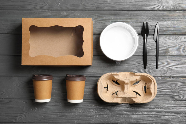 Different containers for mock up design on wooden background, flat lay. Food delivery service - Fotoğraf, Görsel