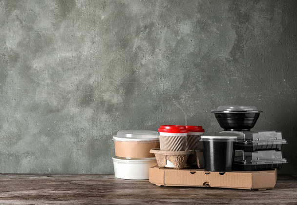 Various takeout containers on table, space for text. Food delivery service - Photo, Image