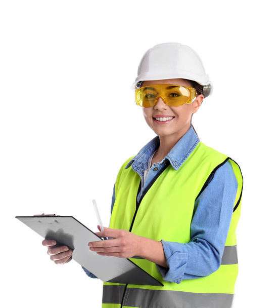 Female industrial engineer in uniform with clipboard on white background. Safety equipment - Fotografie, Obrázek