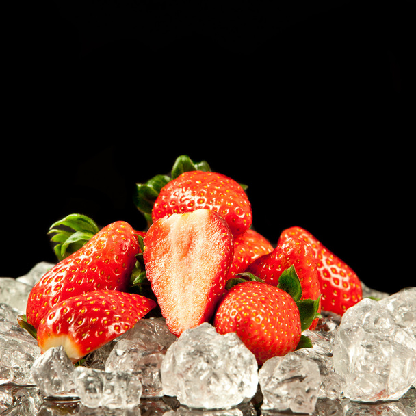 strawberry on black background. strawberries with ice cubes on - Photo, image