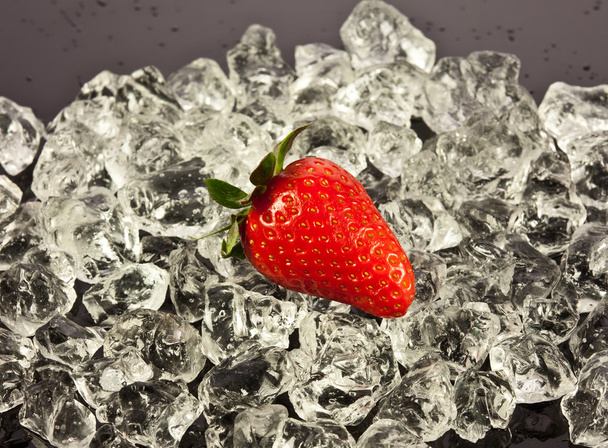 strawberry on black background. strawberries with ice cubes on - Фото, изображение