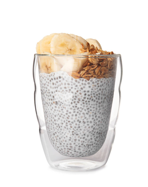 Glass of tasty chia seed pudding with banana and granola on white background - Foto, Imagem