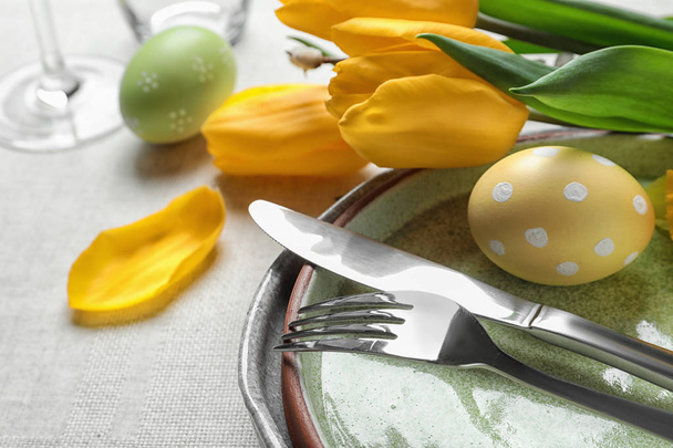 Festive Easter table setting with painted eggs, closeup. Space for text - Zdjęcie, obraz