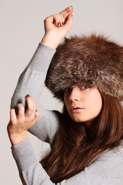 Woman in a furry hat - Фото, изображение