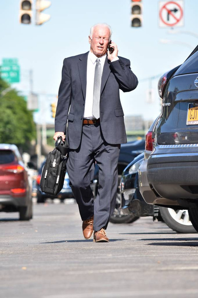Unemotional Adult Senior Business Man Wearing Suit And Tie Walking - Fotó, kép