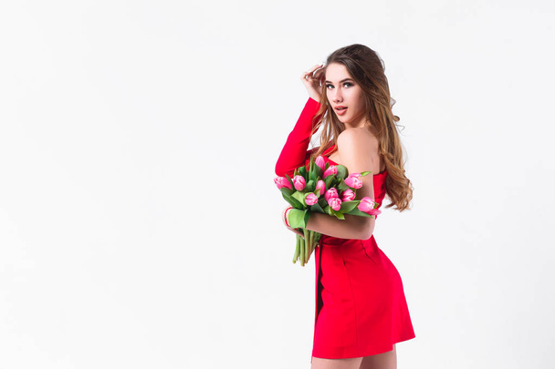 Young attractive woman holding pink tulips isolated on white background - Φωτογραφία, εικόνα