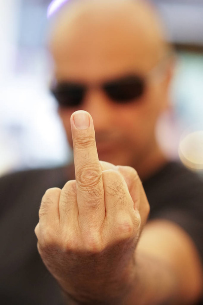 Man giving the middle finger. Selective focus - Photo, Image