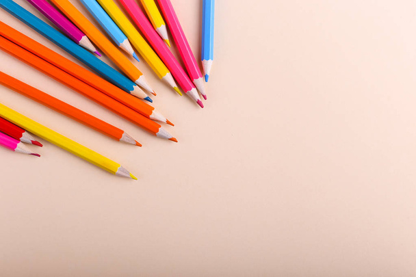 Colored pencils, school supplies for drawing, pattern, copy space. - 写真・画像
