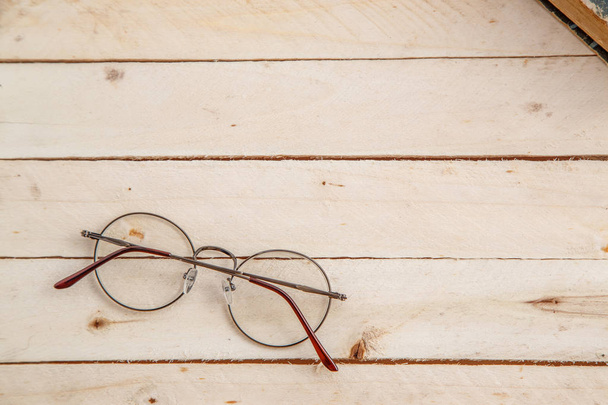 Vintage glasses on a wooden background. Top view - Photo, Image