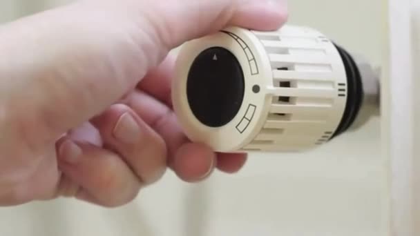 Radiator thermostat, selective focus, white background, turned up to maximum - Video