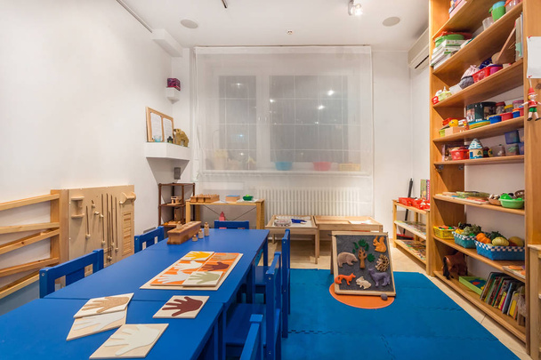 Preschool class waiting kids. Playroom with a lot of object on table. Art room for education children's creativity - Foto, imagen