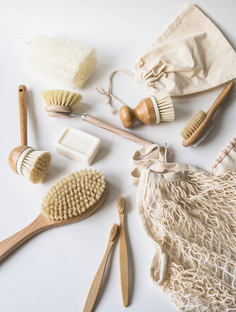 Dish washing brushes, bamboo toothbrushes, reusable bags. Sustainable lifestyle zero waste concept. Clean without waste. No plastic objects. - Fotoğraf, Görsel
