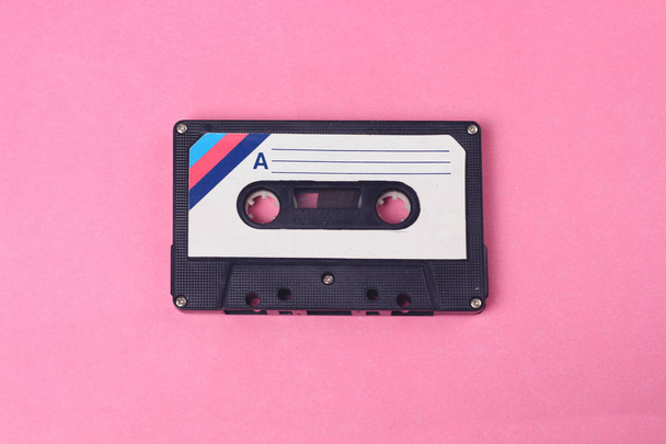 Audio retro vintage cassete tape 80s style on pink background - Photo, Image