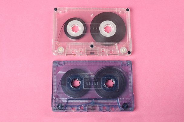 group of two audio retro vintage cassete tape 80s style on pink background - Photo, Image