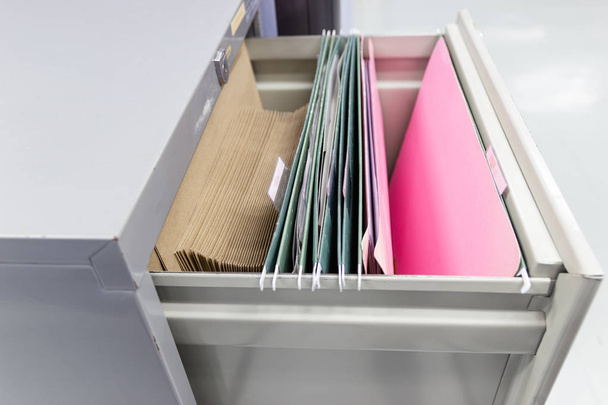 Files document of hanging file folders in a drawer in a whole pile of full papers, at work office Bangkok Thailand Business Concept  - Photo, Image