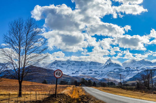 Picture perfect snow capped Drakensberg mountains and green plains in Underberg near Sani pass South Africa - Photo, Image