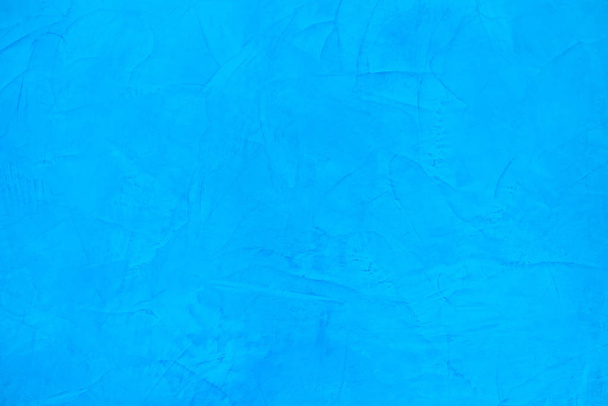 Blue decorative plaster on the wall. Background imitating marble surface - Φωτογραφία, εικόνα