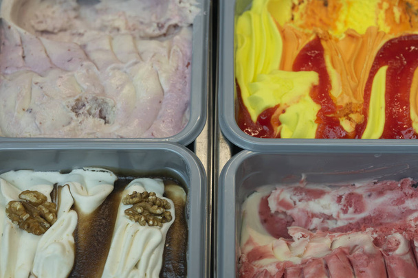 Large selection of Italian ice cream on the counter - Fotó, kép