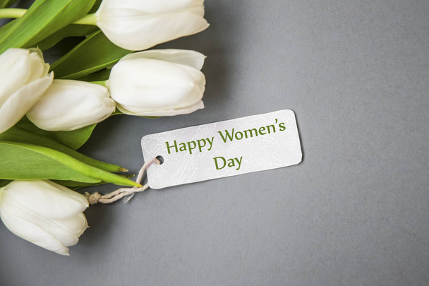 White tulips bouquet with label card , women's day greeting card - Fotó, kép