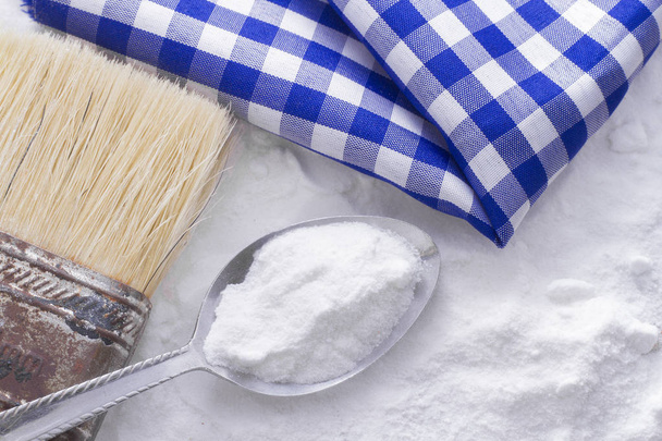 baking soda and brush are the wooden table - Photo, Image