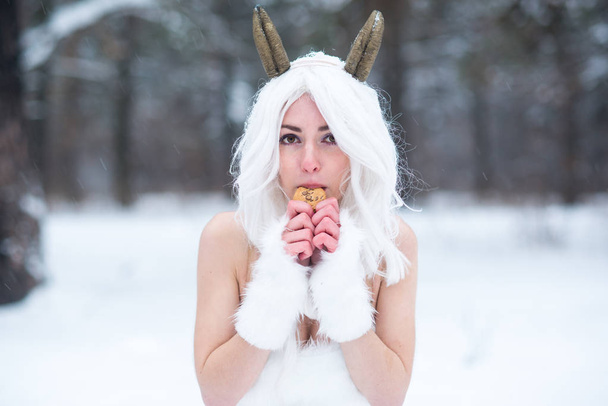 Cosplay girl in fantasy style in snow in winter - 写真・画像