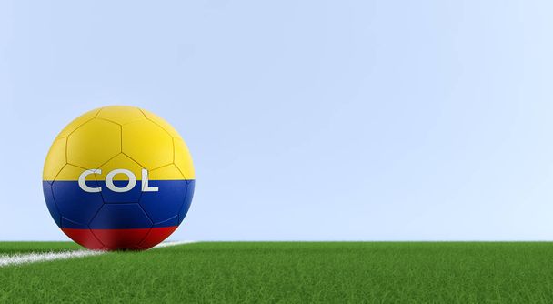 Soccer ball in colombian national colors on a soccer field. Copy space on the right side - 3D Rendering  - Foto, Bild