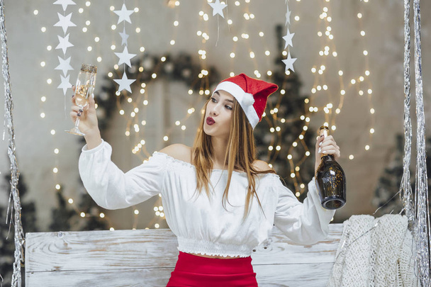 happy woman with champagne against new year decorations - Φωτογραφία, εικόνα