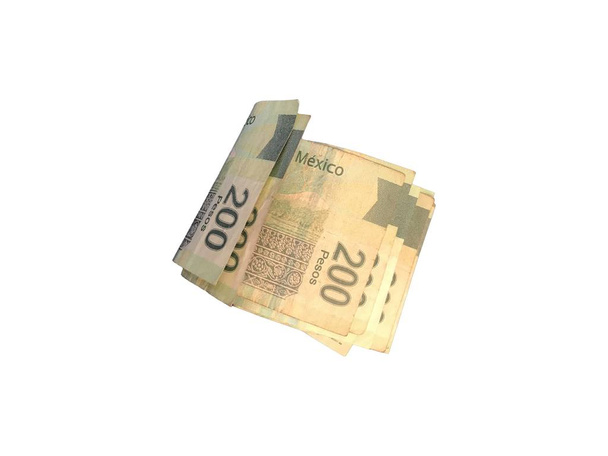 Некоторые мексиканские песо 200 бумажных банкнот сгруппированы и изолированы на белом фоне
 - Фото, изображение